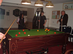 Clubhouse interior showing pool table and darts area
